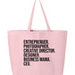 The Entrepreneur Tote Bag from Badd Boss is a custom pastel pink tote bag with bold black text that showcases the titles: "ENTREPRENEUR. PHOTOGRAPHER. CREATIVE DIRECTOR. DESIGNER. BUSINESS MAMA. CEO." This durable, minimalist tote bag features two handles and is perfect for supporting your local small business owners.
