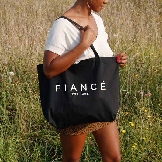 a black bag with white text that says fiance 2024